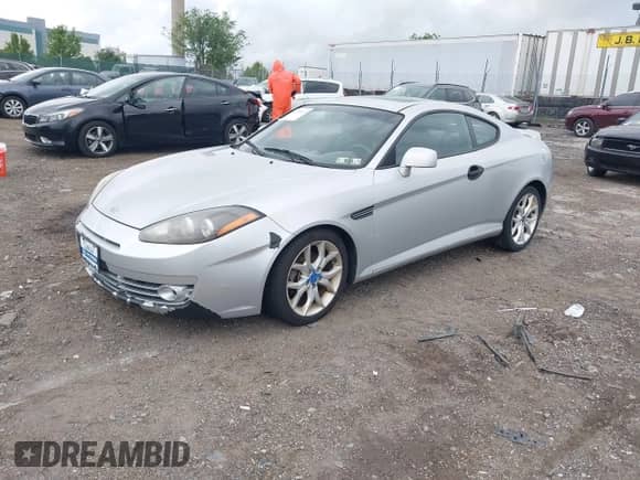 2008 Hyundai Tiburon GT with VIN KMHHN66F98U291391, listed as a IAAI auction lot 42330142 with 135,953 mi miles and . Bid and sale history available at DreamBid. Image 2.