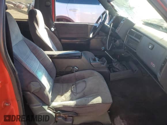 1990 Chevrolet Blazer with VIN 1GNCS18Z2L8113073, listed as a Copart auction lot 87676865 with 22,827 mi miles and Salvage title. Bid and sale history available at DreamBid. Image 7.