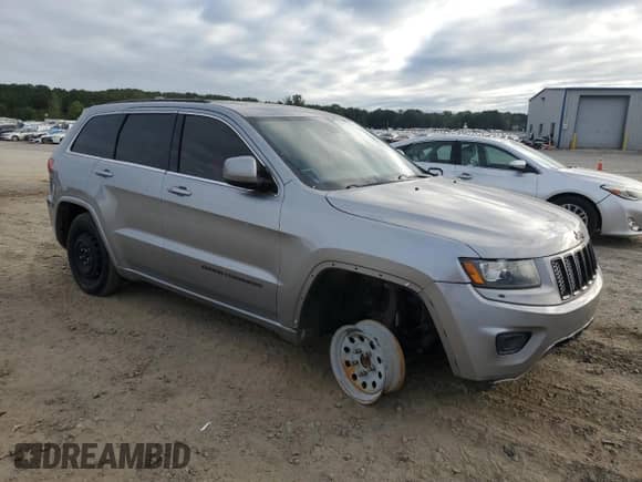 2014 Jeep Grand Cherokee Laredo with VIN 1C4RJEAG2EC556071, listed as a Copart auction lot 83827295 with Not provided miles and Clean title. Bid and sale history available at DreamBid. Image 4.