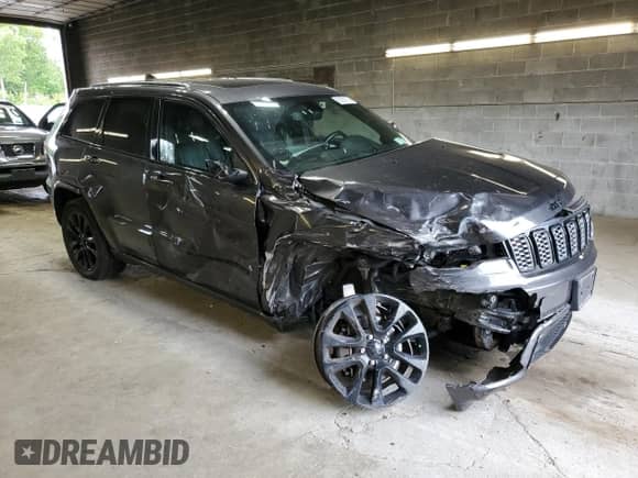 2018 Jeep Grand Cherokee Laredo with VIN 1C4RJFAGXJC487078, listed as a Copart auction lot 63752115 with 69,126 mi miles and Salvage title. Bid and sale history available at DreamBid. Image 4.