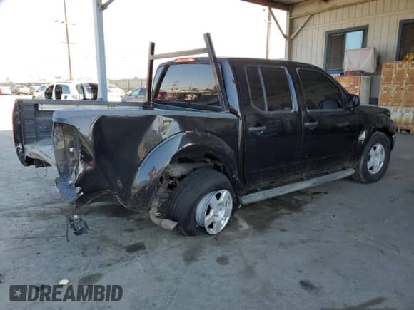 2006 Nissan Frontier LE with VIN 1N6AD07U86C402807, listed as a Copart auction lot 85923755 with 208,716 mi miles and Salvage title. Bid and sale history available at DreamBid. Image 3.