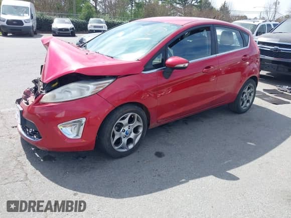2012 Ford Fiesta SES with VIN 3FADP4FJXCM117791, listed as a IAAI auction lot 41829940 with Not provided miles and . Bid and sale history available at DreamBid. Image 2.