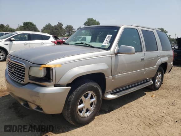 2000 Cadillac Escalade with VIN 1GYEK63R9YR197300, listed as a Copart auction lot 60026815 with 303,297 mi miles and Salvage title. Bid and sale history available at DreamBid. Image 1.