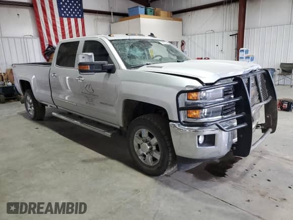 2015 Chevrolet Silverado 3500HD LTZ with VIN 1GC4K0E85FF618155, listed as a Copart auction lot 70803034 with 188,428 mi miles and Salvage title. Bid and sale history available at DreamBid. Image 4.