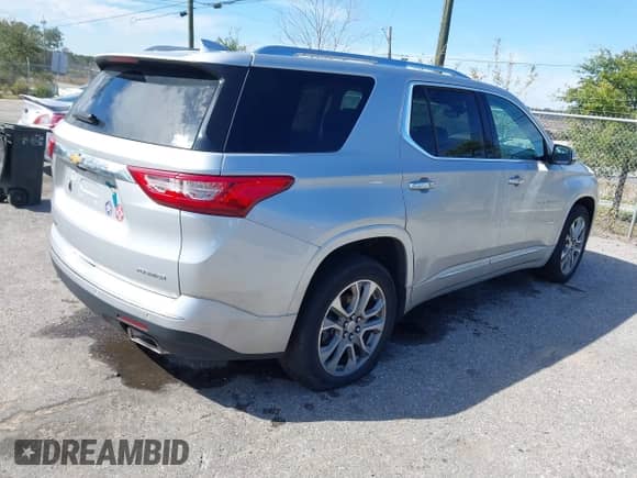 2021 Chevrolet Traverse Premier with VIN 1GNEVKKWXMJ198159, listed as a IAAI auction lot 41616691 with 80,229 mi miles and . Bid and sale history available at DreamBid. Image 4.