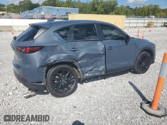 2023 Mazda CX-5 S Carbon Edition z VIN JM3KFBCM7P0169757, wystawiony jako Copart lot #70624645 z przebiegiem 31 275 mil mil oraz Szkoda całkowita • Salvage title. Historia ofert i sprzedaży dostępna na DreamBid. Obrazek 3.