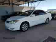 2003 Toyota Camry LE with VIN 4T1BF30K13U057424, listed as a Copart auction lot 76728424 with 198,456 mi miles and Clean title. Bid and sale history available at DreamBid. Image 1.