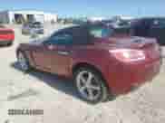 2009 Saturn Sky Red Line with VIN 1G8MF35XX9Y100011, listed as a Copart auction lot 57884065 with 104,714 mi miles and Salvage title. Bid and sale history available at DreamBid. Image 2.