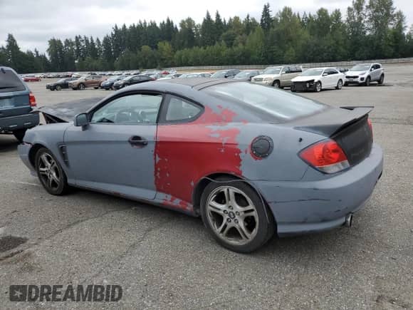 2005 Hyundai Tiburon GT с VIN KMHHN65F35U174824, выставлен на аукционе Copart как лот 81582545 с пробегом Не указан миль и Списание • Salvage title. История ставок и продаж доступна на DreamBid. Изображение 2.