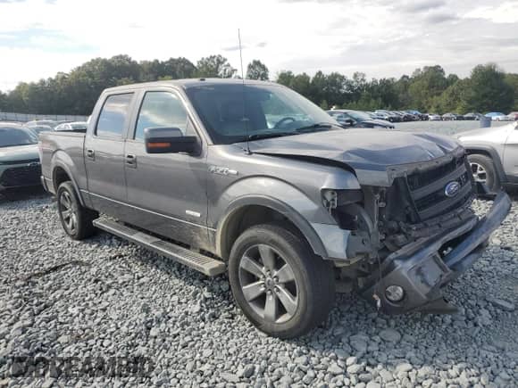 2013 Ford F-150 Lariat with VIN 1FTFW1ET6DFA23450, listed as a Copart auction lot 71629705 with 213,830 mi miles and Salvage title. Bid and sale history available at DreamBid. Image 4.