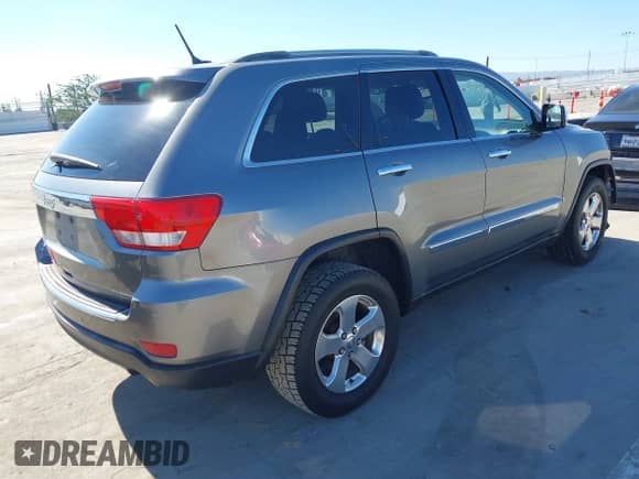 2012 Jeep Grand Cherokee Limited z VIN 1C4RJEBG1CC305182, wystawiony jako IAAI lot #43527445 z przebiegiem 164 219 mil mil oraz . Historia ofert i sprzedaży dostępna na DreamBid. Obrazek 4.