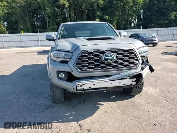 2021 Toyota Tacoma SR5 с VIN 5TFDZ5BN4MX056775, выставлен на аукционе Copart как лот 70674325 с пробегом 55 403 миль миль и Списание • Salvage title. История ставок и продаж доступна на DreamBid. Изображение 13.