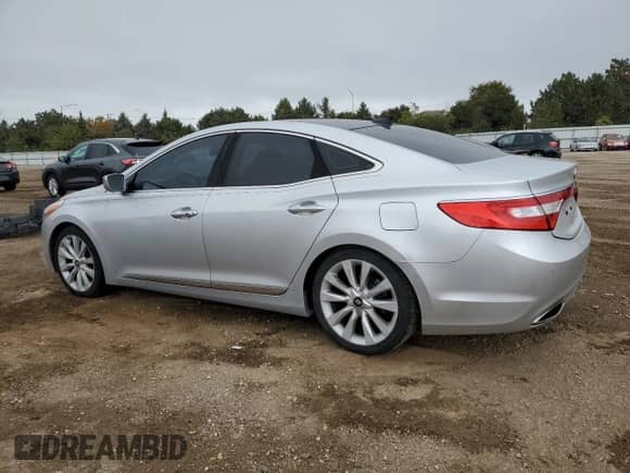 2013 Hyundai Azera с VIN KMHFH4JG6DA270769, выставлен на аукционе Copart как лот 86630765 с пробегом 133 252 миль миль и Списание • Salvage title. История ставок и продаж доступна на DreamBid. Изображение 2.