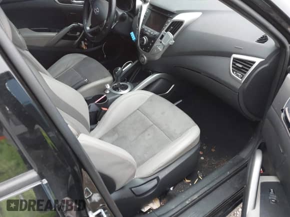 2014 Hyundai Veloster with VIN KMHTC6AD6EU182596, listed as a IAAI auction lot 41498382 with 99,376 mi miles and . Bid and sale history available at DreamBid. Image 5.