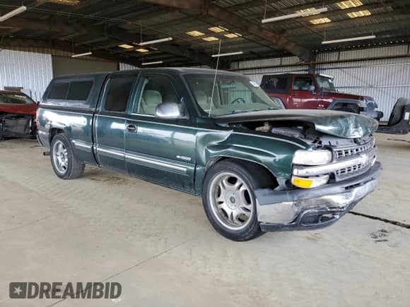 2001 Chevrolet Silverado 1500 with VIN 2GCEC19W411137247, listed as a Copart auction lot 54449525 with 253,035 mi miles and Salvage title. Bid and sale history available at DreamBid. Image 4.