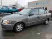 2002 Hyundai Accent GL z VIN KMHCG45C72U269610, wystawiony jako Copart lot #80362953 z przebiegiem 89 481 mil mil oraz Szkoda całkowita • Salvage title. Historia ofert i sprzedaży dostępna na DreamBid. Obrazek 1.