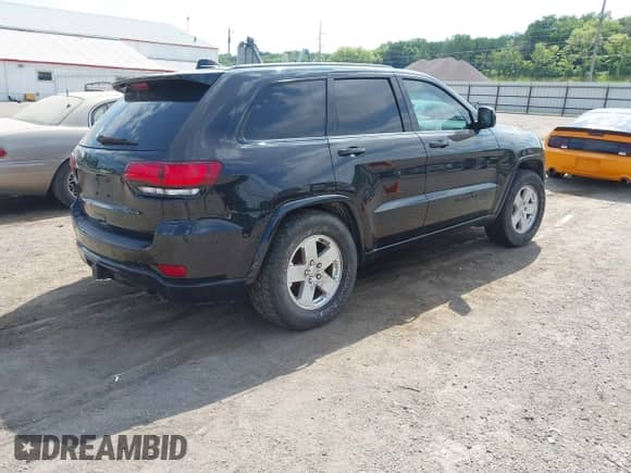 2017 Jeep Grand Cherokee Altitude with VIN 1C4RJFAG3HC889518, listed as a IAAI auction lot 42658201 with 112,264 mi miles and . Bid and sale history available at DreamBid. Image 4.