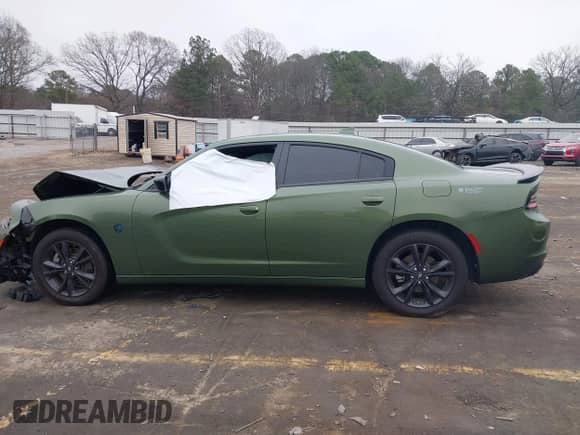 2023 Dodge Charger SXT with VIN 2C3CDXJG1PH657695, listed as a IAAI auction lot 41199974 with 26,013 mi miles and . Bid and sale history available at DreamBid. Image 14.