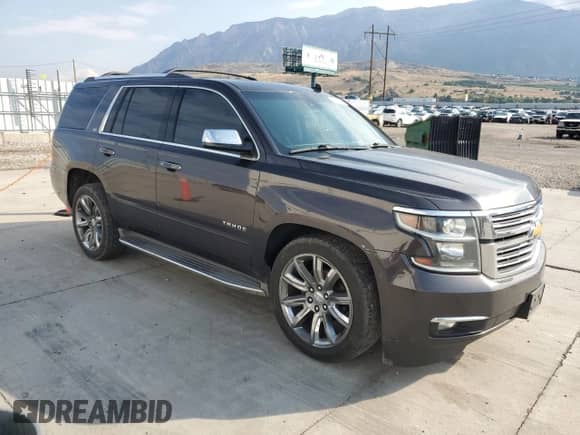 2015 Chevrolet Tahoe LTZ with VIN 1GNSKCKC3FR223897, listed as a Copart auction lot 70163535 with 180,855 mi miles and Salvage title. Bid and sale history available at DreamBid. Image 4.
