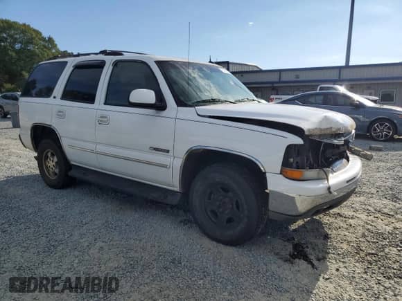 2003 Chevrolet Tahoe LT with VIN 1GNEC13Z63R105243, listed as a Copart auction lot 71419035 with 328,362 mi miles and Salvage title. Bid and sale history available at DreamBid. Image 4.