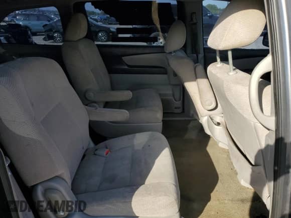 2012 Honda Odyssey LX z VIN 5FNRL5H23CB114839, wystawiony jako Copart lot #57137305 z przebiegiem 205 439 mil mil oraz Szkoda całkowita • Salvage title. Historia ofert i sprzedaży dostępna na DreamBid. Obrazek 11.