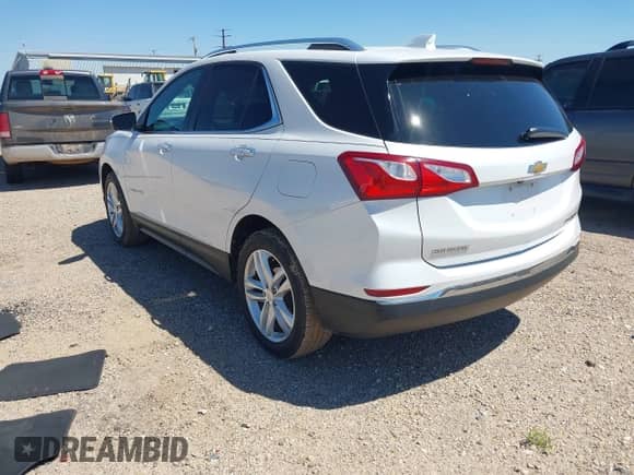 2018 Chevrolet Equinox Premier with VIN 2GNAXVEVXJ6104478, listed as a IAAI auction lot 43056014 with 82,627 mi miles and . Bid and sale history available at DreamBid. Image 3.
