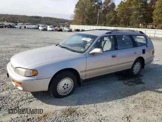 1996 Toyota Camry z VIN 4T1EG12K8TU779386, wystawiony jako Copart lot #79189014 z przebiegiem 142 891 mil mil oraz Czysty tytuł • Clean title. Historia ofert i sprzedaży dostępna na DreamBid. Obrazek 1.