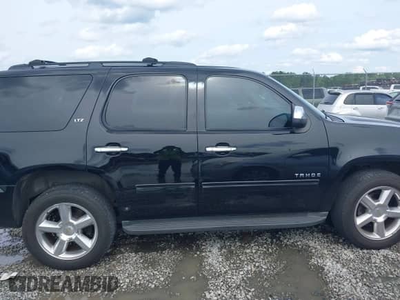 2014 Chevrolet Tahoe LS with VIN 1GNSCAE05ER128680, listed as a IAAI auction lot 42388442 with 240,611 mi miles and . Bid and sale history available at DreamBid. Image 13.