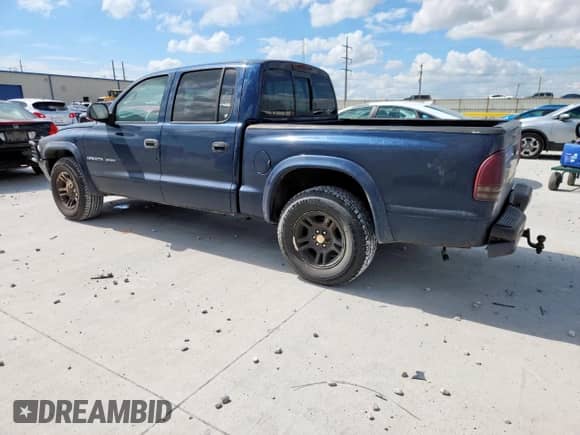 2002 Dodge Dakota Sport z VIN 1B7HL38N62S692851, wystawiony jako Copart lot #63767335 z przebiegiem 218 871 mil mil oraz Szkoda całkowita • Salvage title. Historia ofert i sprzedaży dostępna na DreamBid. Obrazek 2.