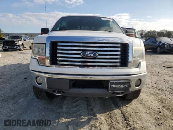2012 Ford F-150 XL with VIN 1FTFW1ET6CFB11851, listed as a Copart auction lot 71863715 with 233,512 mi miles and Salvage title. Bid and sale history available at DreamBid. Image 5.