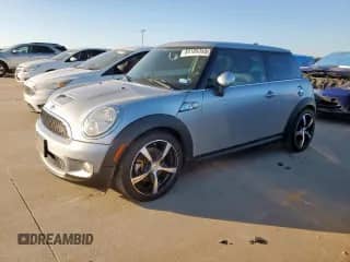 2009 MINI Hardtop S with VIN WMWMF73509TT99369, listed as a Copart auction lot 84188355 with 83,106 mi miles and Salvage title. Bid and sale history available at DreamBid. Image 1.