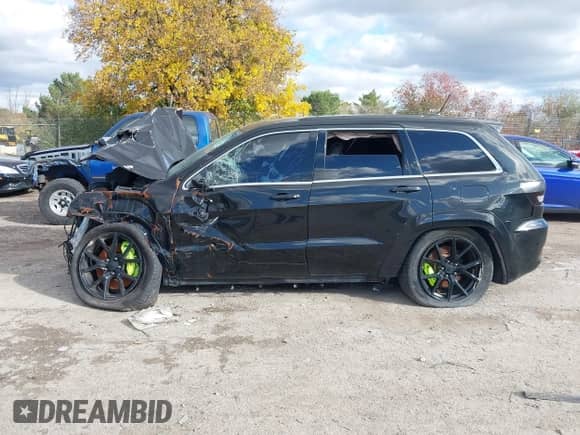 2012 Jeep Grand Cherokee SRT-8 with VIN 1C4RJFDJ9CC148452, listed as a IAAI auction lot 43511139 with Not provided miles and . Bid and sale history available at DreamBid. Image 13.