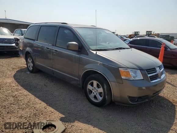 2010 Dodge Grand Caravan SXT z VIN 2D4RN5D11AR467155, wystawiony jako Copart lot #71179835 z przebiegiem 142 262 mil mil oraz Czysty tytuł • Clean title. Historia ofert i sprzedaży dostępna na DreamBid. Obrazek 4.