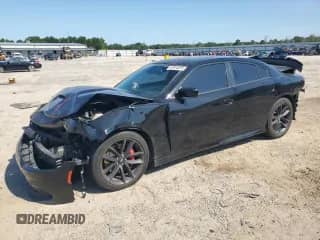 2021 Dodge Charger R/T with VIN 2C3CDXCT9MH598448, listed as a Copart auction lot 61910215 with 87,616 mi miles and Salvage title. Bid and sale history available at DreamBid. Image 1.