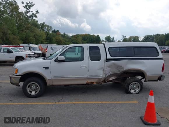 1998 Ford F-150 with VIN 1FTRX18L0WKC22686, listed as a IAAI auction lot 43270211 with 128,823 mi miles and . Bid and sale history available at DreamBid. Image 14.