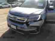 2021 Honda Pilot Touring 7-Passenger with VIN 5FNYF5H69MB000710, listed as a IAAI auction lot 43081838 with 91,899 mi miles and . Bid and sale history available at DreamBid. Image 6.