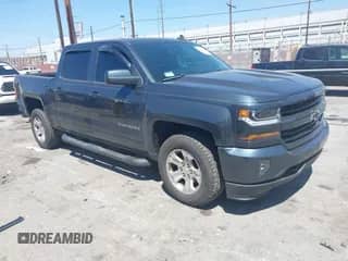 2018 Chevrolet Silverado 1500 LT z VIN 3GCUKREC1JG511846, wystawiony jako IAAI lot #42024170 z przebiegiem 121 532 mil mil oraz . Historia ofert i sprzedaży dostępna na DreamBid. Obrazek 1.