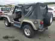 2004 Jeep Wrangler Sahara с VIN 1J4FA59S84P801582, выставлен на аукционе Copart как лот 64183535 с пробегом 127 213 миль миль и Списание • Salvage title. История ставок и продаж доступна на DreamBid. Изображение 2.