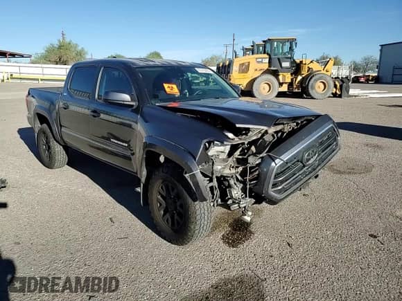2018 Toyota Tacoma SR5 with VIN 3TMAZ5CN0JM053620, listed as a Copart auction lot 87210405 with 142,309 mi miles and Salvage title. Bid and sale history available at DreamBid. Image 14.