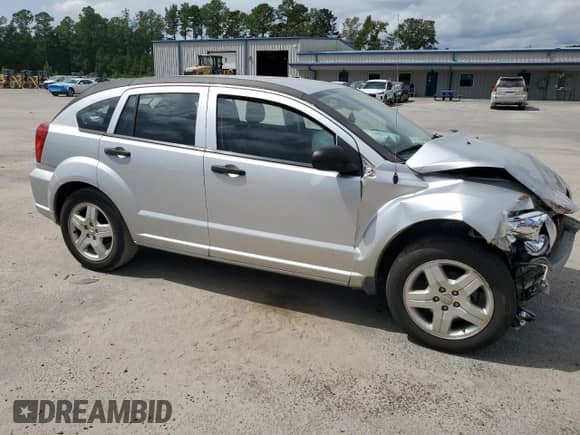2011 Dodge Caliber with VIN 1B3CB1HA3BD262733, listed as a Copart auction lot 83993445 with Not provided miles and Salvage title. Bid and sale history available at DreamBid. Image 4.