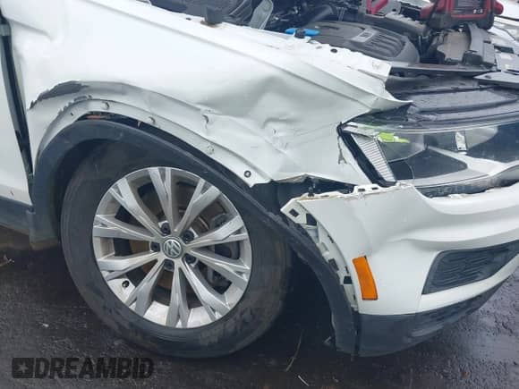 2019 Volkswagen Tiguan S with VIN 3VV1B7AXXKM087166, listed as a IAAI auction lot 42672005 with 68,269 mi miles and . Bid and sale history available at DreamBid. Image 6.