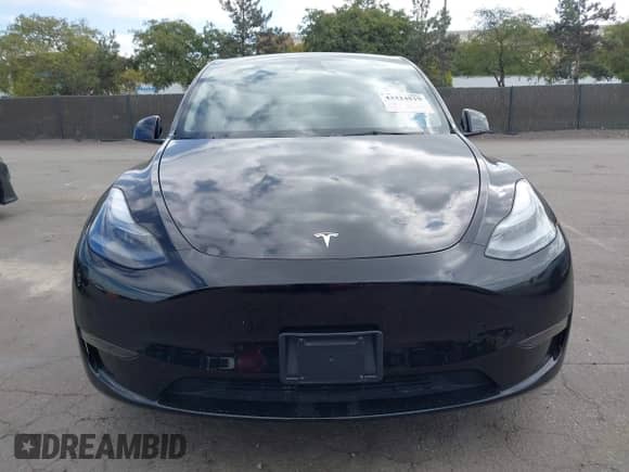 2024 Tesla Model Y with VIN 7SAYGDED8RF156984, listed as a IAAI auction lot 43324819 with 26,941 mi miles and . Bid and sale history available at DreamBid. Image 12.