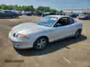 2001 Hyundai Tiburon с VIN KMHJG25FX1U237982, выставлен на аукционе Copart как лот 65774595 с пробегом 125 241 миль миль и Списание • Salvage title. История ставок и продаж доступна на DreamBid. Изображение 1.