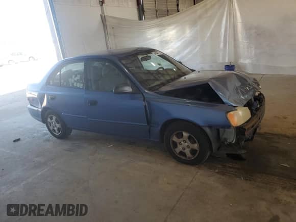 2000 Hyundai Accent z VIN KMHCG45G6YU066218, wystawiony jako Copart lot #84948715 z przebiegiem 110 059 mil mil oraz Szkoda całkowita • Salvage title. Historia ofert i sprzedaży dostępna na DreamBid. Obrazek 4.