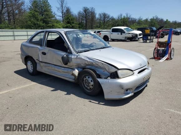 1999 Hyundai Accent L z VIN KMHVD14N9XU497814, wystawiony jako Copart lot #60374665 z przebiegiem 287 585 mil mil oraz Szkoda całkowita • Salvage title. Historia ofert i sprzedaży dostępna na DreamBid. Obrazek 4.