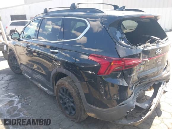 2023 Hyundai Santa Fe XRT with VIN 5NMS64AJ4PH490636, listed as a IAAI auction lot 43136441 with 82,841 mi miles and . Bid and sale history available at DreamBid. Image 3.