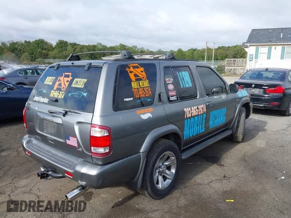 2004 Nissan Pathfinder SE z VIN JN8DR09Y94W909054, wystawiony jako IAAI lot #43419692 z przebiegiem 186 677 mil mil oraz . Historia ofert i sprzedaży dostępna na DreamBid. Obrazek 4.