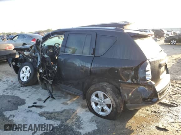 2014 Jeep Compass Sport with VIN 1C4NJCBA2ED507850, listed as a Copart auction lot 85699295 with 104,728 mi miles and Non repairable. Bid and sale history available at DreamBid. Image 2.