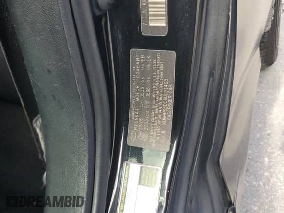 2006 Hyundai Tiburon GS with VIN KMHHM65D06U191468, listed as a Copart auction lot 70183555 with 195,594 mi miles and Salvage title. Bid and sale history available at DreamBid. Image 12.