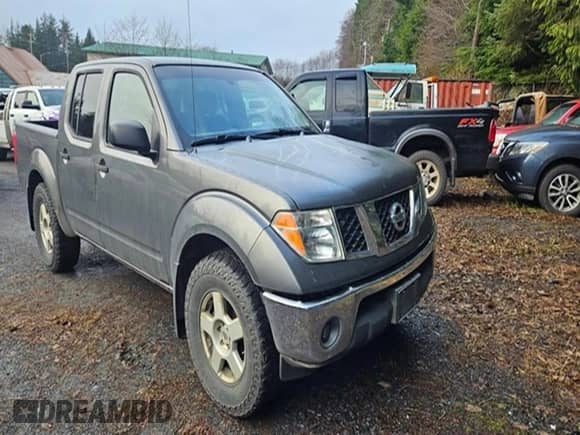 2007 Nissan Frontier LE with VIN 1N6AD07W17C402392, listed as a Copart auction lot 83113564 with 152,584 mi miles and Salvage title. Bid and sale history available at DreamBid. Image 4.